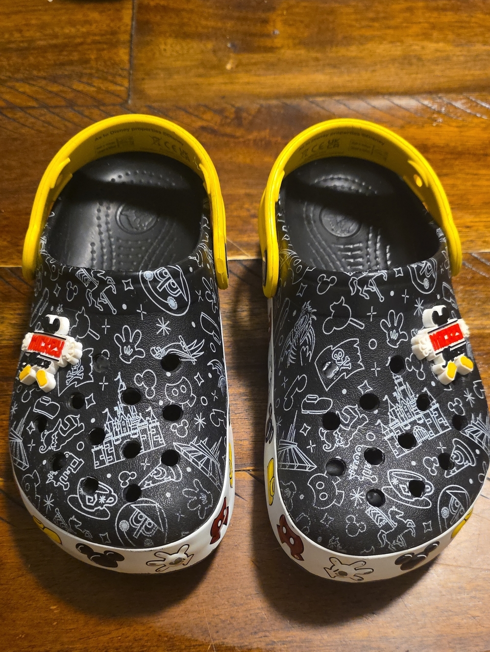 CROCS Kids Black Clog with Yellow Heel Straps and Disney Print